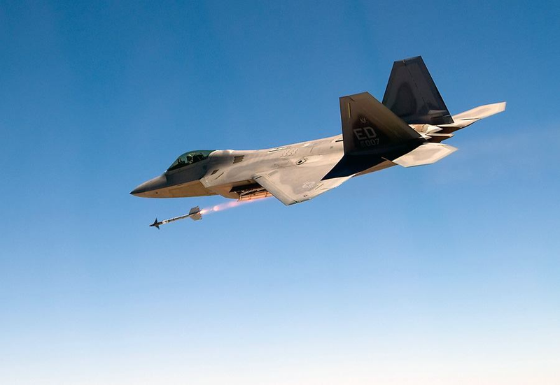 Illustration for article titled Cool photos of Raptors firing missiles from their hidden weapons bays